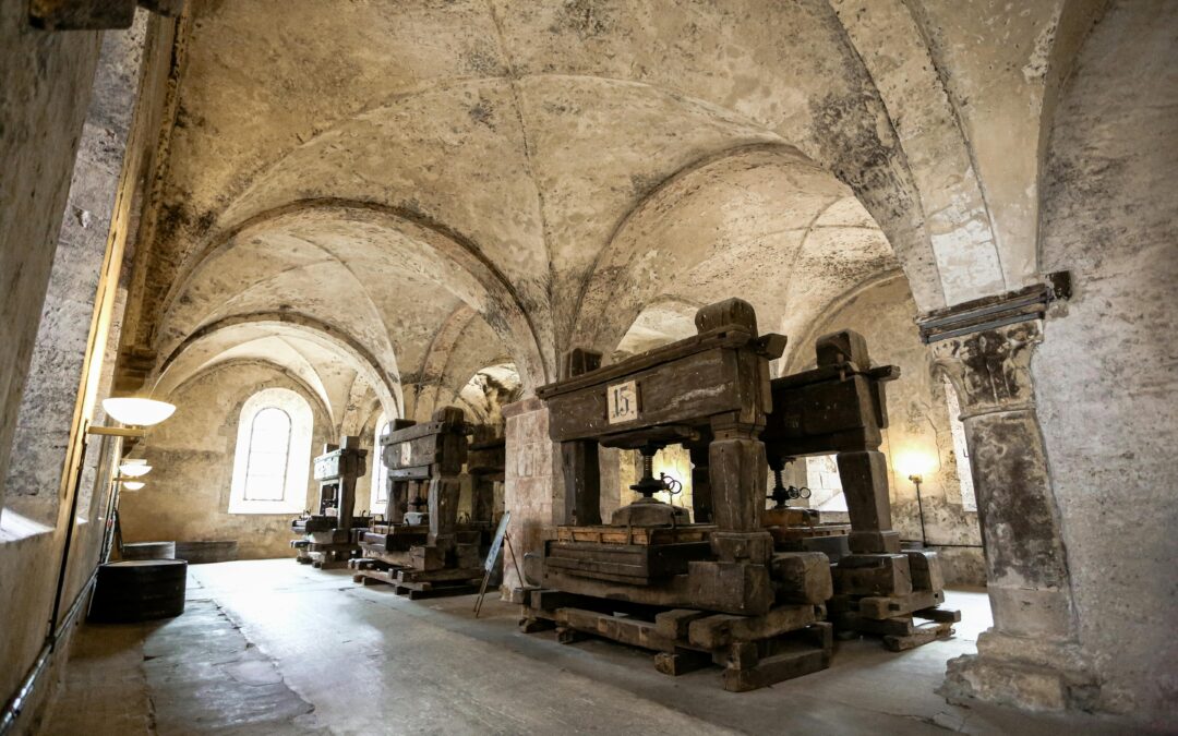 Gutenberg press with early movable type printing, representing the origins of modern graphic design.