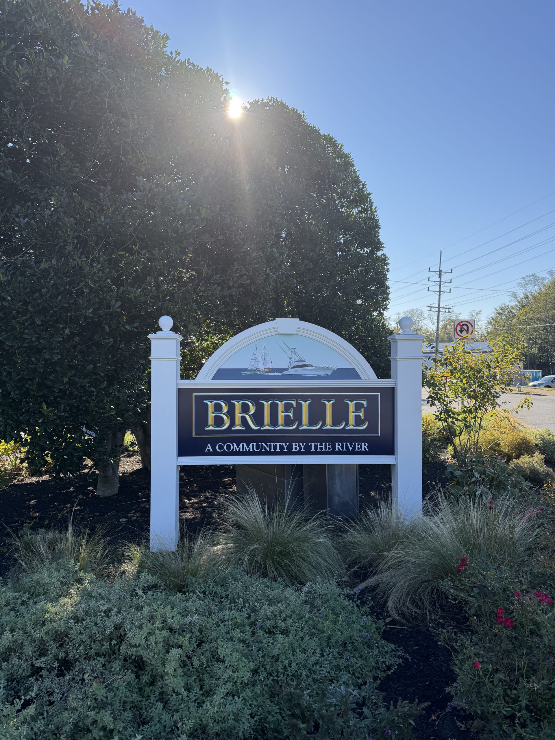 Robert Hazelrigg Unveils New Brielle NJ Welcome Sign Robert Hazelrigg The Graphics Guy standing beside the newly designed Brielle New Jersey welcome sign at Route 35 and Higgins Avenue.